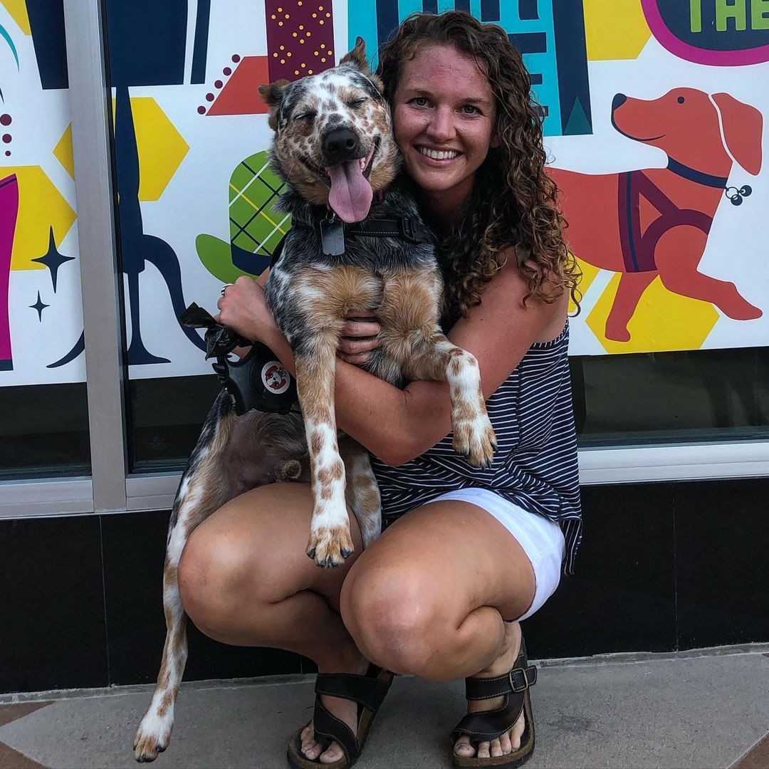 happy woman posing with dog