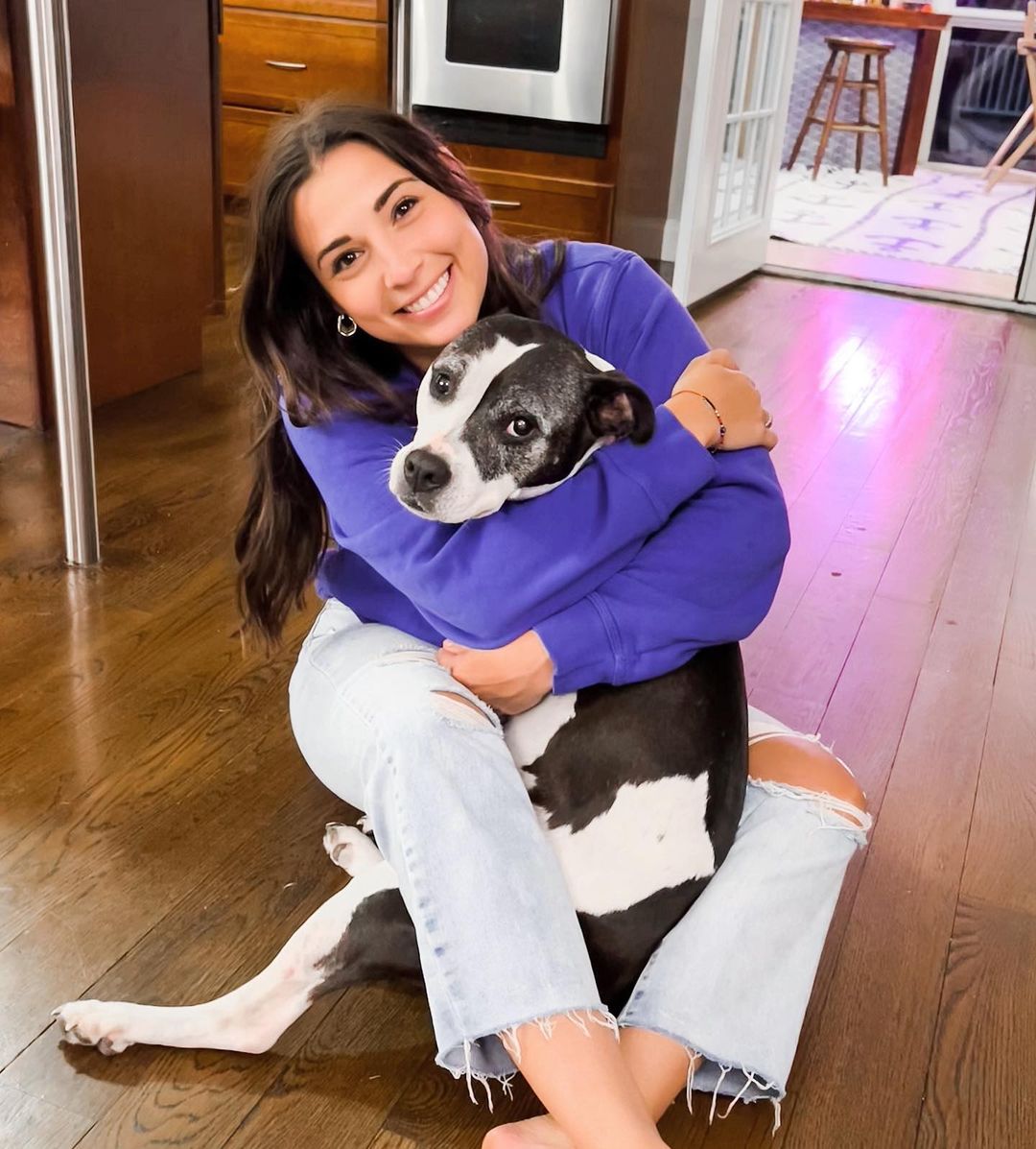 woman hugging a dog