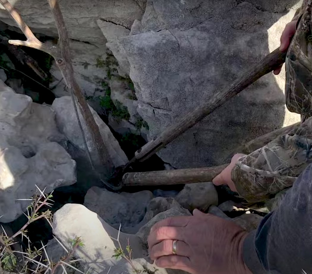 man checking a rocks