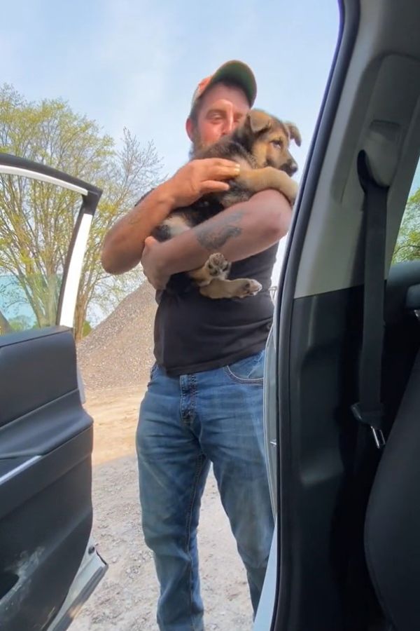 man holding the pup