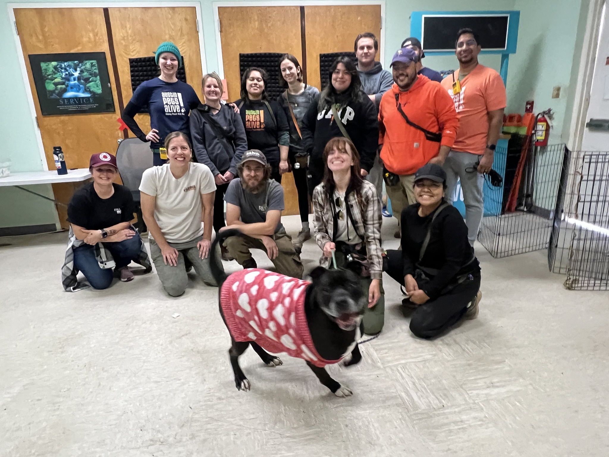 people posing with dog