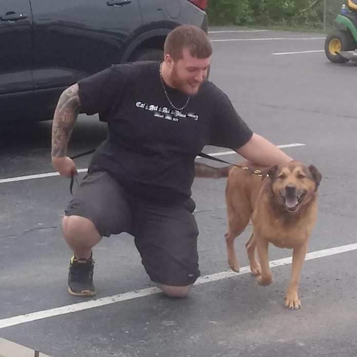 photo of man and a dog