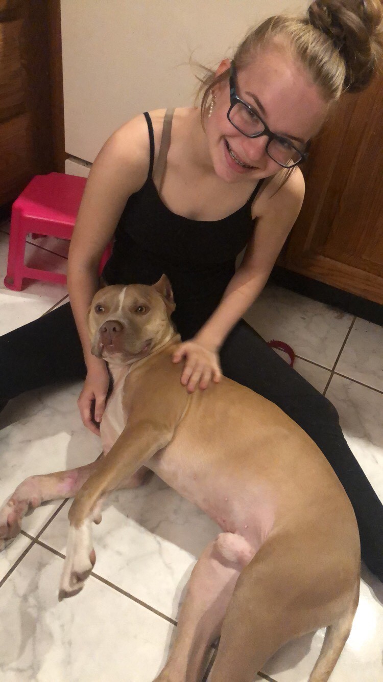 smiling young girl with dog