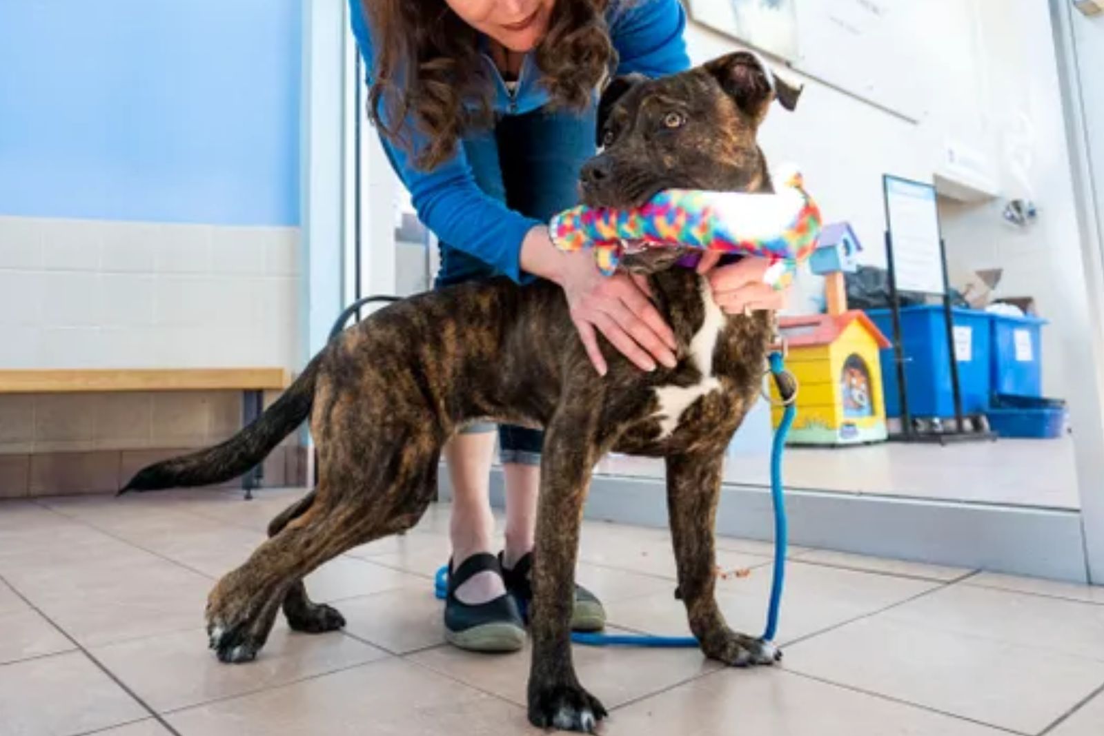 woman holding pup with unusual condition