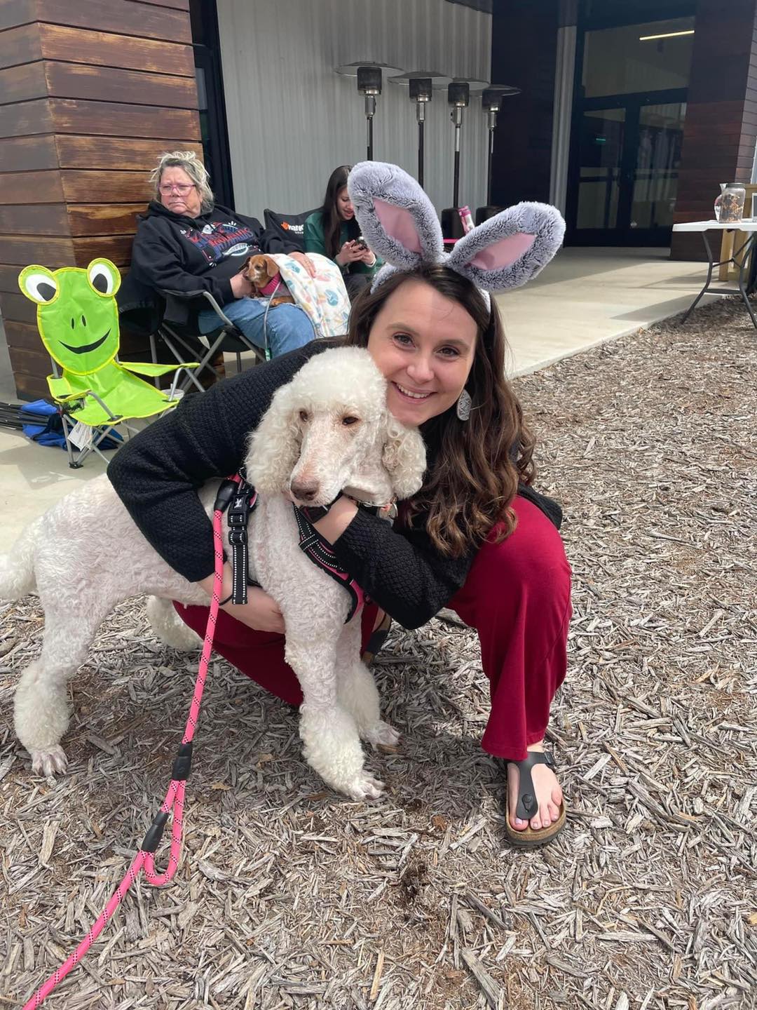 woman hugging rescue poodle