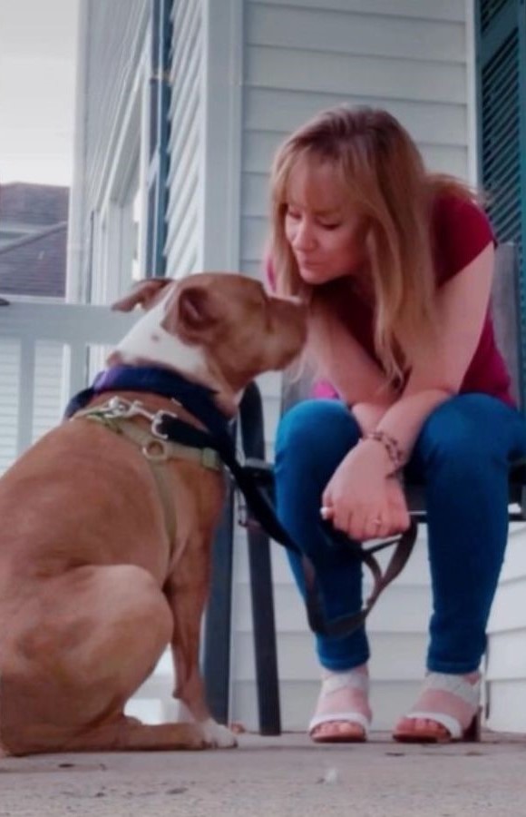 woman talking to dog