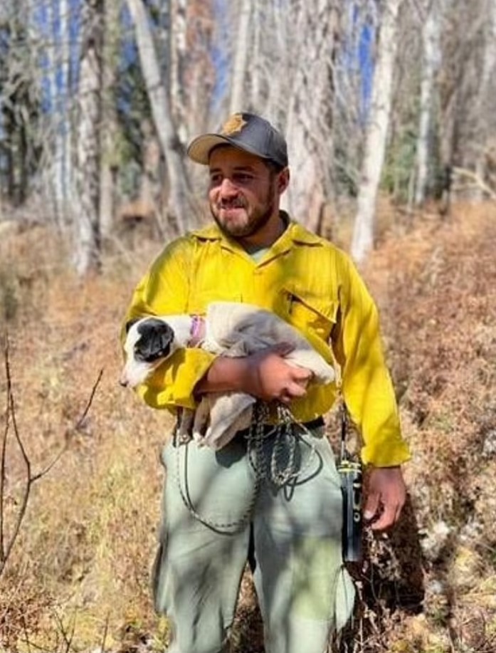 young guy holding a dog