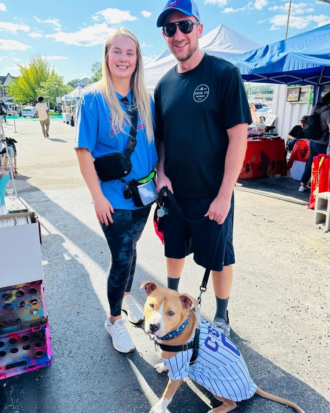 man and a woman with a dog