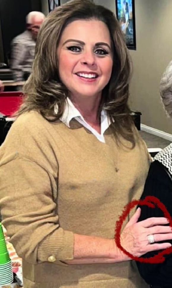 smiling woman with her wedding ring