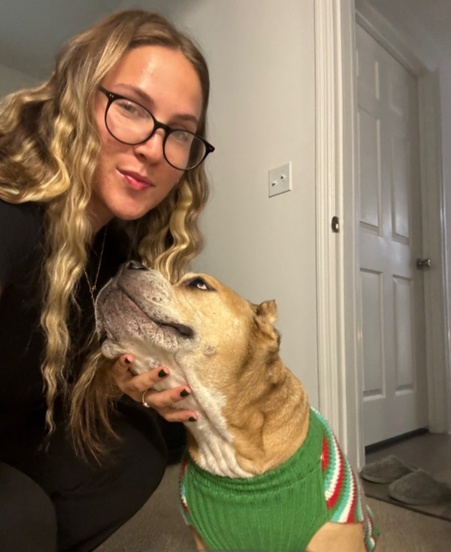 blonde woman and dog with clothes on