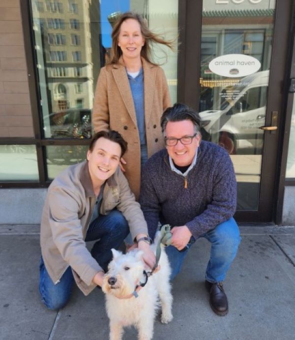 family and white dog