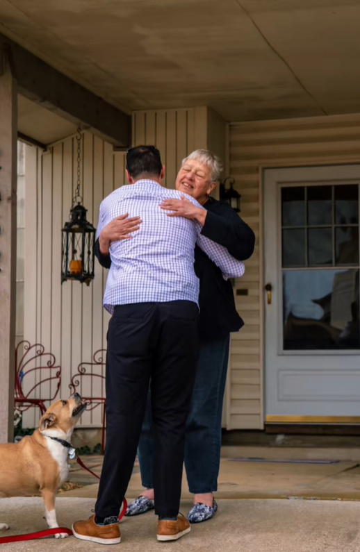 man hugging a woman