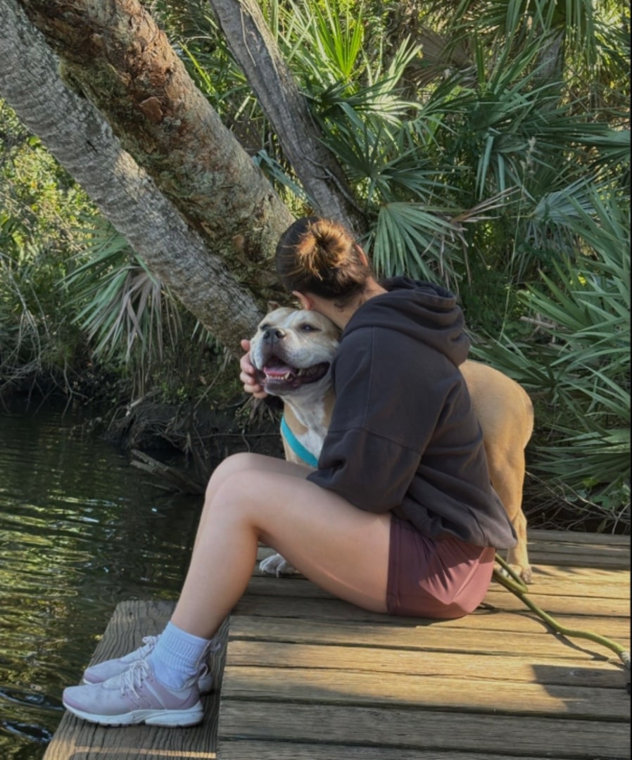 woman hugging a cute dog